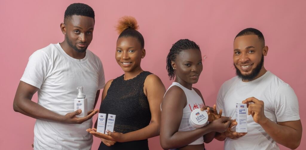 Group of Models holding up TNS skincare products